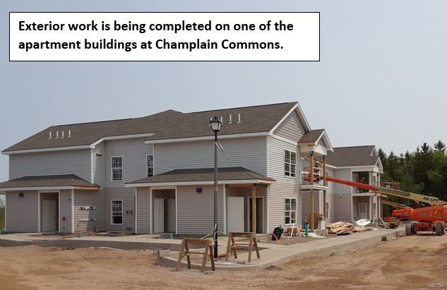 Exterior Work being finished on an apartment building at Champlain Commons